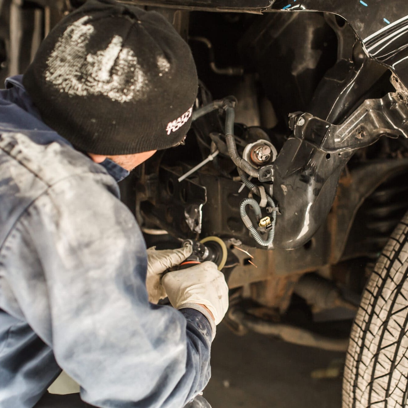 Mechanic Repairing Car